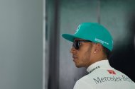 Mercedes driver Lewis Hamilton of Britain walks inside his team garage during the second practice session ahead of the Formula One Malaysian Grand Prix in Sepang, outside Kuala Lumpur on March 28, 2014