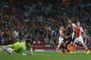 Arsenal's Alexis Sanchez, second right, scores a goal during a second leg Champions League qualifying soccer match between Arsenal and Besiktas at Emirates Stadium in London Wednesday, Aug. 27, 2014.(AP Photo/Kirsty Wigglesworth)