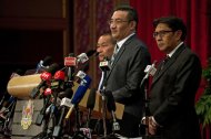 Malaysian Defence Minister Hishammuddin Hussein (2nd right) delivers a statement on missing Malaysia Airlines flight MH370 during a press conference at the Putra World Trade Center (PWTC) in Kuala Lumpur, on March 31, 2014