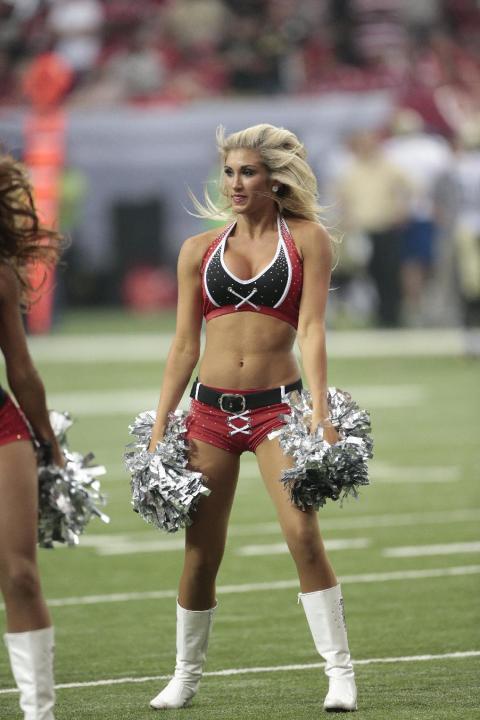 Atlanta Falcons cheerleaders perform during the second half of an NFL football game against the New Orleans Saints, Sunday, Sept. 7, 2014, in Atlanta. (AP Photo/John Bazemore)