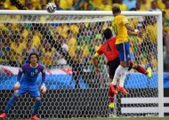 Brazil's Neymar (R) and Mexico's Rafael Marquez jump for the ball in front of Mexico's goalkeeper Guillermo Ochoa during their Group A match, at Castelao Stadium in Fortaleza, during the FIFA World Cup, on June 17, 2014