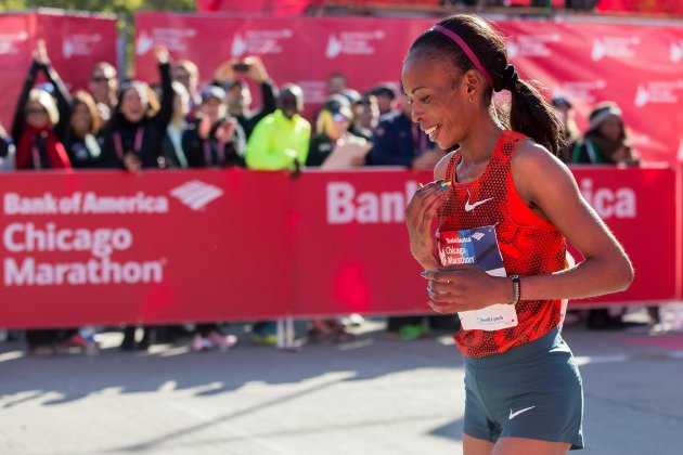 Rita Jeptoo of Kenya reacts after crossing the finish line to win the women&amp;#39;s race during the Chicago Marathon on Sunday, Oct. 12, 2014, in Chicago.  Chicago&amp;#39;s 37th annual race included a field of 108 elite men, women and wheelchair athletes. There were also 45,000 amateur runners registered and more than 1 million people were expected to watch along the way.(AP Photo/Andrew A. Nelles)
