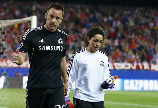 Chelsea&amp;#39;s captain John Terry is escorted off the pitch by the team doctor Eva Carneiro