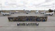 In this photo taken April 29, 2014 provided by the Australia Defence Force, multinational air-crew and aircraft involved in operation "Southern Indian Ocean" are assembled for a photo at RAAF Base Pearce, in Perth, Western Australia. Seven nations, including Australia, New Zealand, the U.S., South Korea, Malaysia, China and Japan, have flew daily search mission out to the southern Indian Ocean in the massive multinational hunt for the missing Malaysia Airlines Flight 370. (AP Photo/Australian Defence Force, Cpl. Nicci Freeman)