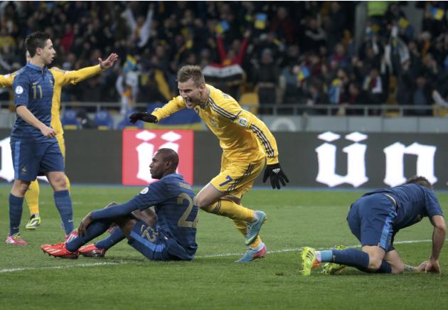 Ukraine's Andriy Yarmolenko celebrates a goal scored by his team mate Roman Zozulya during their 2014 World Cup qualifying first leg playoff soccer match against France at the Olympic stadium in Kiev