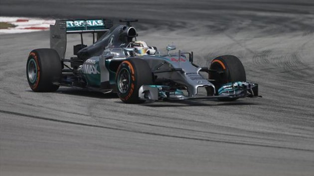 Mercedes Formula One driver Lewis Hamilton of Britain takes a corner during the first practice session of the Malaysian F1 Grand Prix at Sepang