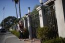 Woman leaves flowers outside the home of actor and comedian Robin Williams in Tiburon, California