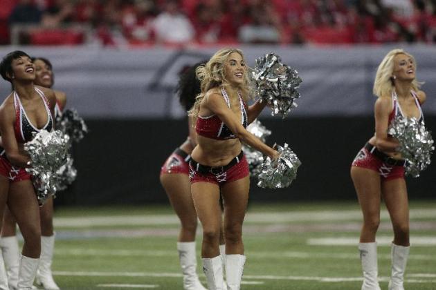 Atlanta Falcons cheerleaders perform before the first half of an NFL football game against the New Orleans Saints, Sunday, Sept. 7, 2014, in Atlanta. (AP Photo/John Bazemore)