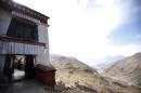 A monk looks down from Yerpa monastery in Lhasa