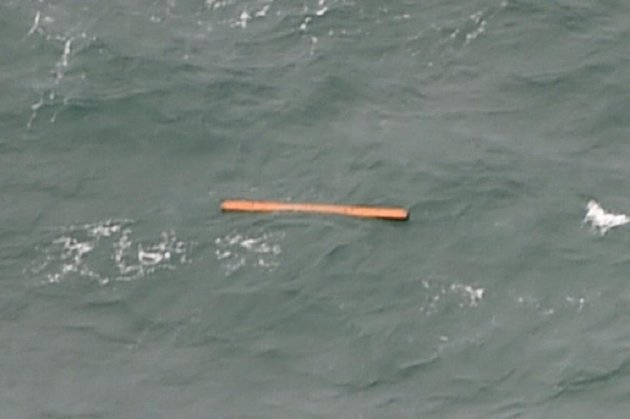 One of the pieces of alleged plane debris spotted floating in the water. (AFP photo)