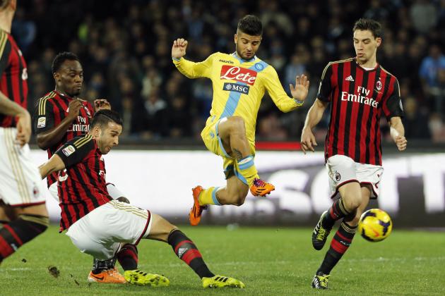 AC Milan's Essien, Rami and De Sciglio challenge Napoli's Insigne during their Italian Serie A soccer match in Naples