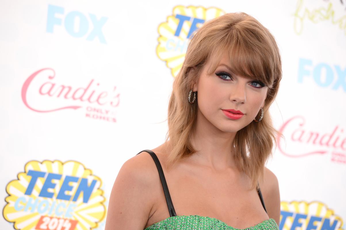 FILE - This Aug. 10, 2014 file photo shows Taylor Swift at the Teen Choice Awards at the Shrine Auditorium in Los Angeles. Swift says she’s releasing her first full-length pop album on Oct. 27. The 24-year-old revealed in a livestream via Yahoo! on Monday , Aug, 18, that “1989,” named after her birth year, is her “first documented official pop album.” (Photo by Jordan Strauss/Invision/AP, File)