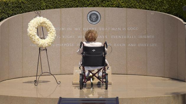 Former first lady Nancy Reagan visits the grave site of her husband, President Ronald Reagan, at the Ronald Reagan Presidential Library, Thursday, June 5, 2014, in Simi Valley, Calif. Today marks the 