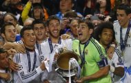 Real Madrid's captain Iker Casillas (3rd R) and team mates celebrate with the trophy after defeating Atletico Madrid in their Champions League final soccer match at the Luz Stadium in Lisbon, May 24, 2014. REUTERS/Kai Pfaffenbach