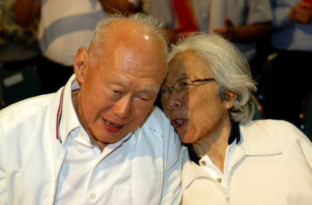 FILE - In this May 1, 2006, file photo, Singapore&amp;#39;s then Minister Mentor Lee Kuan Yew, left, shares a light moment with his wife, Kwa Geok Choo, right, during the Labour Day Rally in Singapore. Lee Kuan Yew, the founder of modern Singapore who helped transform the sleepy port into one of the world&amp;#39;s richest nations, died Monday, March 23, 2015, the government said. He was 91. (AP Photo/Wong Maye-E, File)