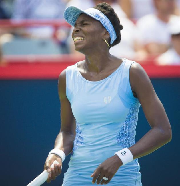 APX01. Montreal (Canada), 10/08/2014.- Venus Williams of the US reacts during her finals match against Agnieszka Radwanska of Poland at the Rogers Cup women tennis tournament in Montreal, Canada, 10 A