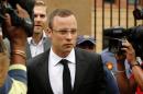 Oscar Pistorius leaves the court after his trial for   the murder of his girlfriend, Reeva Steenkamp, was postponed at the North Gauteng   High Court in Pretoria March 28, 2014. REUTERS/Siphiwe Sibeko