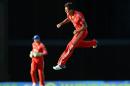 England's cricketer Jade Dernbach leaps in the air to celebrate their victory during the final T20 match between England and West Indies at the Kensington Oval in Bridgetown on March 13, 2014