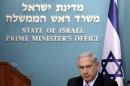 Israel's Prime Minister Benjamin Netanyahu reacts during a news conference at his office in Jerusalem