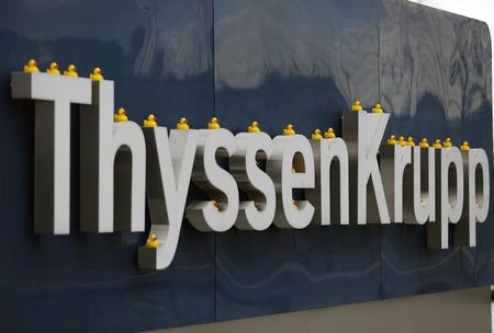 Toy ducks are placed on a sign of Germany's top steelmaker ThyssenKrupp during a protest at their headquarters in Essen February 25, 2014. REUTERS/Ina Fassbender