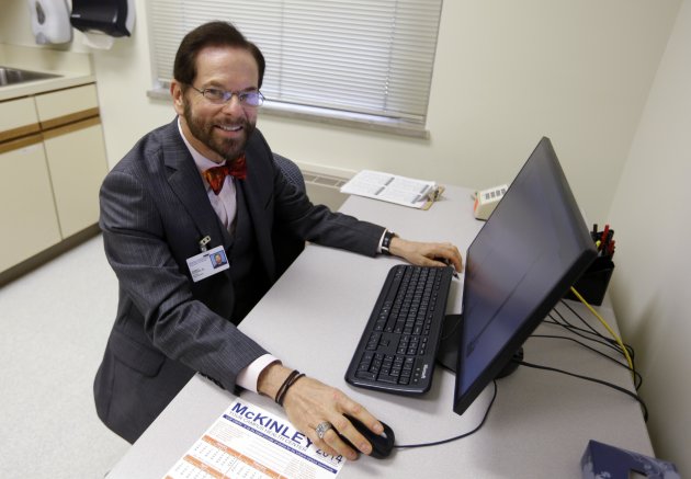 Dr. Robert Palinkas, director of the McKinley Health Center at the University of Illinois, poses in an exam room in Urbana, Ill., Thursday, Aug. 21, 2014. Extra health checks are part of protocols campuses throughout the United States have in place as they prepare for as many as 10,000 students from Nigeria, Guinea, Liberia and Sierra Leone, where more than 1,000 people have died in the worst Ebola outbreak in history. (AP Photo/Michael Conroy)