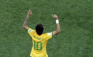 Brazil's Neymar celebrates scoring his side's first goal during the group A World Cup soccer match between Brazil and Croatia, the opening game of the tournament, in the Itaquerao Stadium in Sao Paulo, Brazil, Thursday, June 12, 2014. (AP Photo/Shuji Kajiyama)