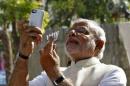Hindu nationalist Narendra Modi, prime ministerial   candidate for India's main opposition BJP, takes "selfie" with   mobile phone after casting his vote at a polling station during seventh phase of   India's general election in Ahmedabad
