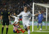 Real Madrid's Gareth Bale celebrates after he scored a goal against Atletico Madrid during their Champions League final soccer match at Luz stadium in Lisbon, May 24, 2014. REUTERS/Kai Pfaffenbach