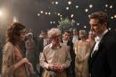 This image released by Sony Pictures Classics shows director Woody Allen, center, with actors Emma Stone, left, and Colin Firth on the set of "Magic in the Moonlight." (AP Photo/Sony Pictures Classics, Jack English)
