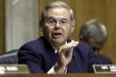 FILE - In this July 17, 2014, file photo,. Senate Foreign Relations Chairman Robert Menendez, D-N.J., gestures as she speaks on Capitol Hill in Washington. Menendez threatened Thursday, July 24, to block U.S. arms sales to Iraq if Congress doesn't get an assessment of Iraqi forces and assurances the weapons won't fall into the hands of extremist militants.(AP Photo/J. Scott Applewhite, File)