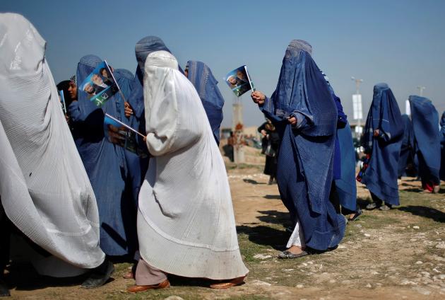 Supporters of Afghan presidential candidate Abdullah arrive to attend an election rally in Mazar-I-Shariff