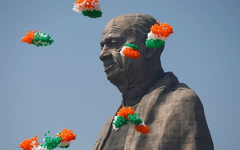 Indian tri-coloured balloons fly around the 