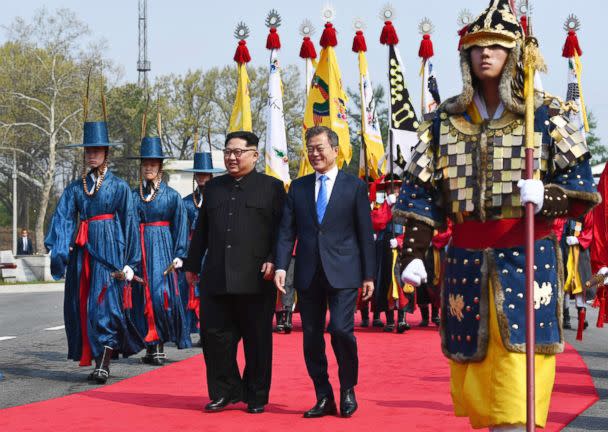 PHOTO: North Korean leader Kim Jong Un and South Korean President Moon Jae-in walk together at the border village of Panmunjom in the Demilitarized Zone, April 27, 2018. (Korea Summit Press Pool via AP)