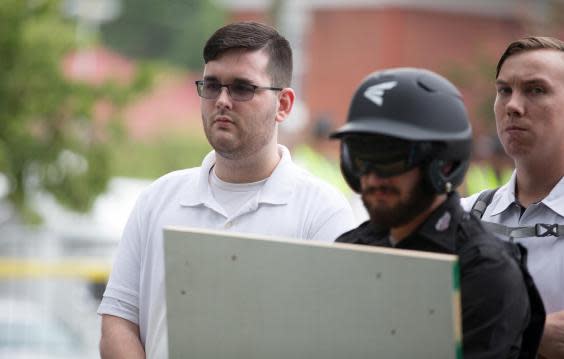 James Alex Fields Jr, (L) seen attending the Unite the Right rally in Charlottesville prior to arrest (REUTERS)