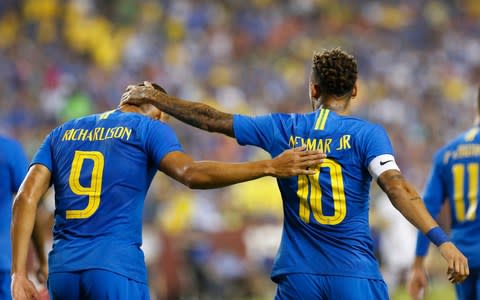 Brazil forward Gabriel Richarlison (9) celebrates with Brazil forward Neymar (10) after scoring a goal against El Salvador in the first half during an international friendly soccer match - Credit: USA Today