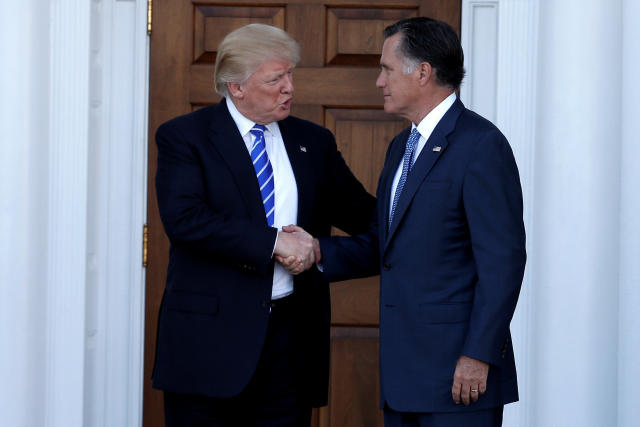 Former Massachusetts Gov. Mitt Romney (R) shakes hands with then President-elect Donald Trump following a meeting in New Jersey in 2016. (Mike Segar/Reuters)