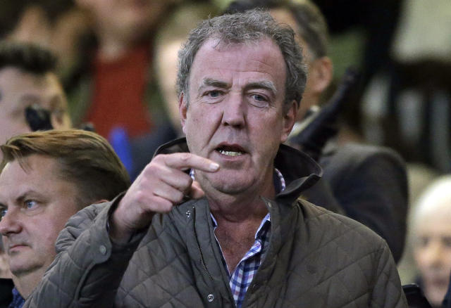 FILE - In this Wednesday, March 11, 2015 file photo TV host Jeremy Clarkson gestures as he takes his place in the stands before the Champions League round of 16 second leg soccer match between Chelsea and Paris Saint Germain at Stamford Bridge stadium in London. Clarkson, the former host of hit BBC auto show 