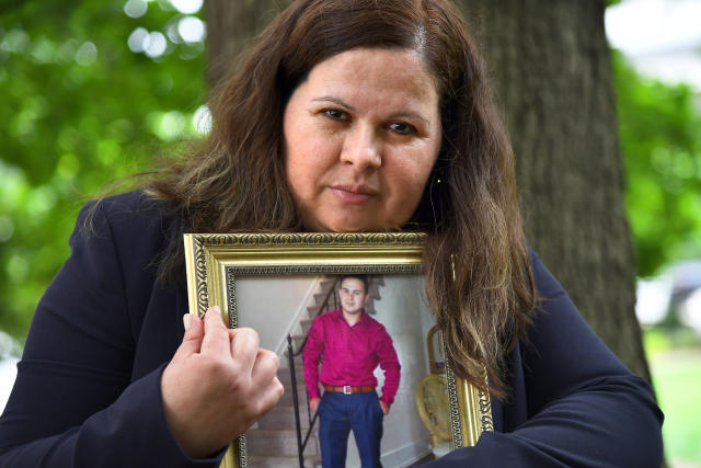 Bertha Morales holds a photograph of her son, Christian Villagran-Morales, who was murdered by members of the MS-13 gang in 2016. (Katherine Frey/The Washington Post via Getty Images)