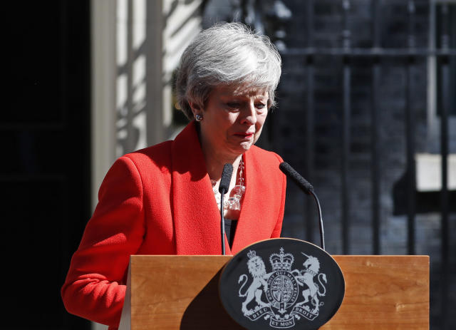 British Prime Minister Theresa May reacts as she turns away after making a speech in the street outside 10 Downing Street in London, England, Friday, May 24, 2019. Theresa May says she'll quit as UK Conservative leader on June 7, sparking contest for Britain's next prime minister. (AP Photo/Alastair Grant)