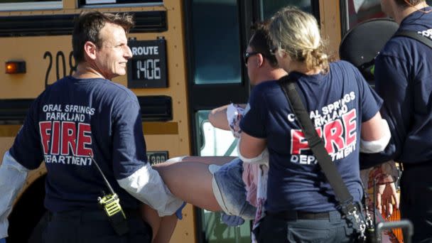 PHOTO: Medical personnel tend to a victim following a shooting at Marjory Stoneman Douglas High School in Parkland, Fla., on Feb. 14, 2018. (John McCall/South Florida Sun-Sentinel via AP)