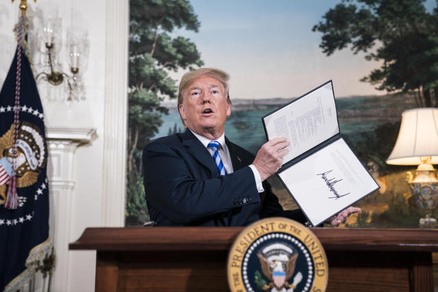 President Donald J. Trump signs a National Security Presidential Memorandum as he announces the withdrawal of the United States from the Iran nuclear deal during a 