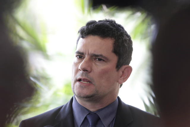 Former Brazilian Judge Sergio Moro, who was appointed Justice Minister by President-elect Jair Bolsonaro, speaks to the press as he arrives to his team's transition office in Brasilia, Brazil, Monday, Nov. 26, 2018. Bolsonaro will be sworn in as Brazil's next president on Jan. 1, 2019. (AP Photo/Eraldo Peres)