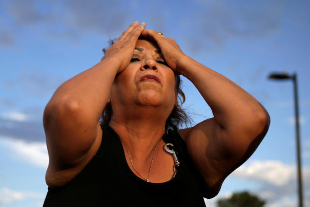 A woman reacts after a mass shooting at a Walmart in El Paso, Texas, U.S. August 3, 2019. REUTERS/Jose Luis Gonzalez