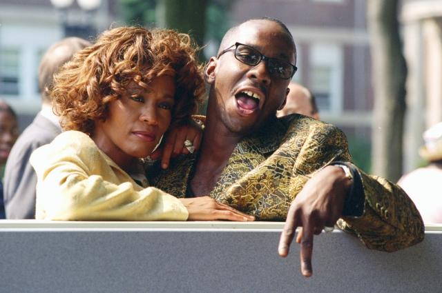 UNITED STATES - JUNE 12: Whitney Houston is joined by her husband, singer Bobby Brown, at ceremonies in East Orange, N.J., where the Franklin School was renamed the Whitney E. Houston Academy of Creative and Performing Arts. (Photo by Richard Corkery/NY Daily News Archive via Getty Images)